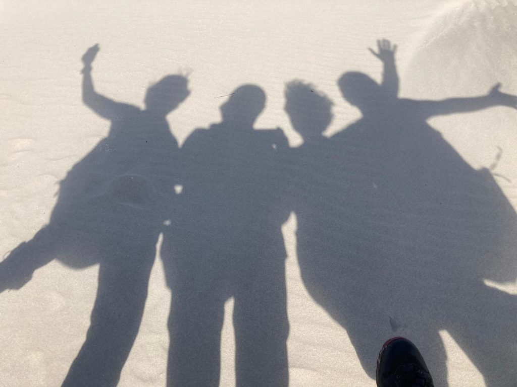 Foto Orgineelste T schaduw zon groepje strand
